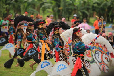 Group of people in traditional clothing during festival