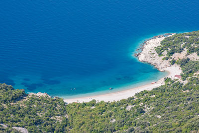 High angle view of bay against clear blue sky