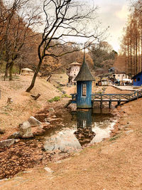 House by river against building