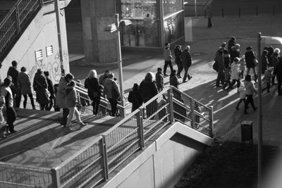 High angle view of people walking in city