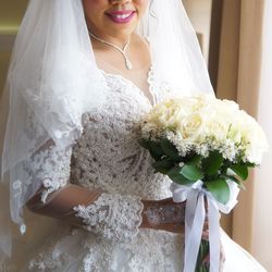 Close-up of woman holding bouquet of white flower