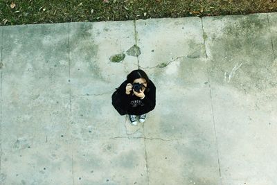 High angle view of man standing on railing