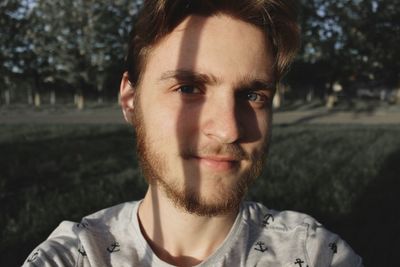 Close-up portrait of young man smiling
