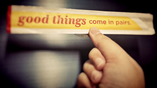 Close-up of hand holding text