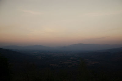 Scenic view of landscape against sky during sunset