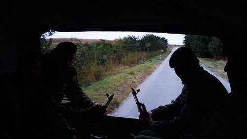 Silhouette people sitting in bus