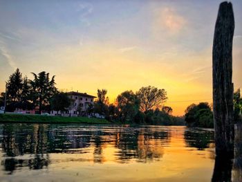 Scenic view of lake against sky during sunset