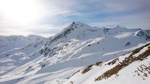 Scenic view of snow covered mountains