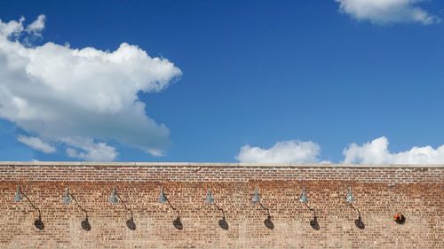 Low angle view of building against blue sky