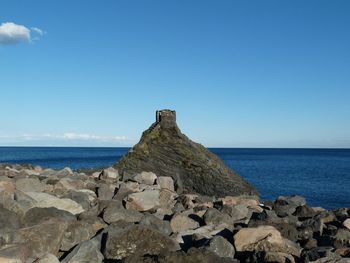 Scenic view of sea against clear blue sky