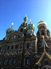 Low angle view of orthodox church against clear blue sky