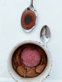Directly above shot of cake in plate against white background