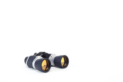 Close-up of camera over white background
