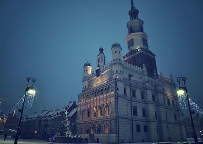 Low angle view of illuminated tower at night