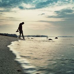 Woman standing on beach