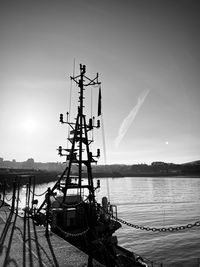 Sailboat moored at harbor