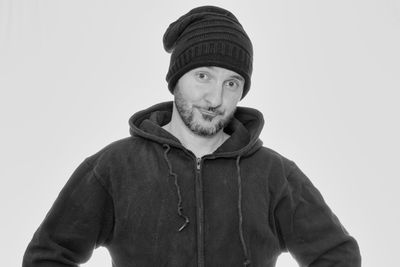 Portrait of man wearing hat against white background