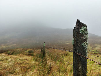 View of wooden fence on mountain