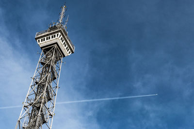 Low angle view of vapor trail against blue sky