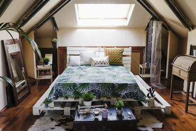 Beautiful attic bedroom with modern decoration