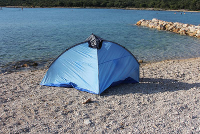 Tent on beach by sea
