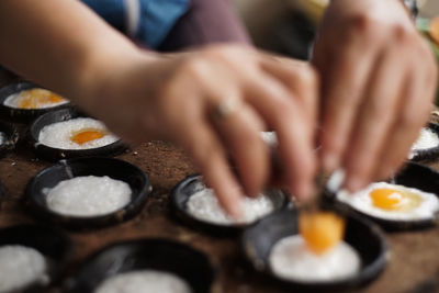 Midsection of person preparing food