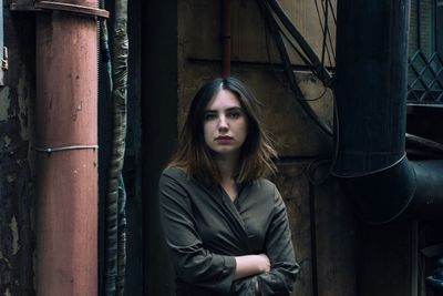 Portrait of young woman standing outdoors