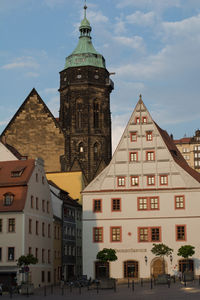 View of buildings in city against sky