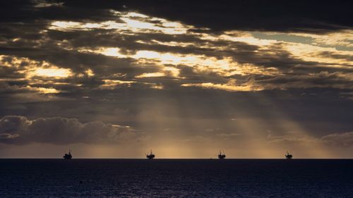 Scenic view of sea against sky at sunset