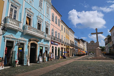 Street amidst buildings against sky