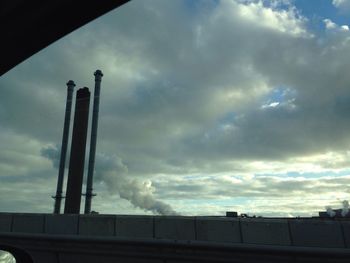 Low angle view of building against cloudy sky