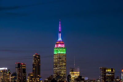 Illuminated buildings in city at night