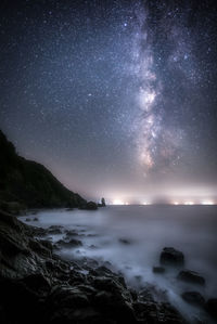 Scenic view of sea against sky at night