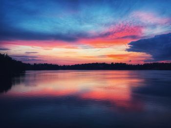 Scenic view of lake against romantic sky at sunset