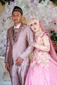 Portrait of young couple during wedding ceremony