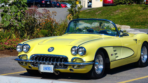 Yellow car parked on street