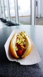 Close-up of hotdog on table