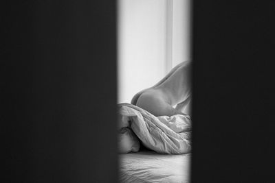 Woman relaxing on bed at home