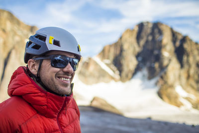 Portrait of smiling man in snow