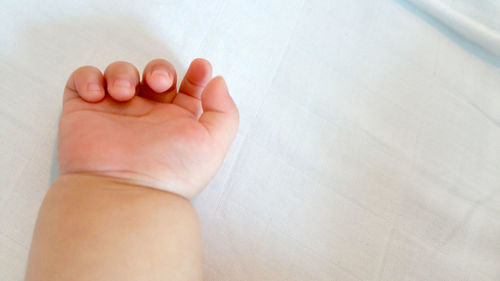 Low section of baby feet