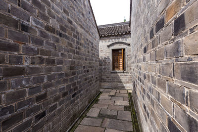 View of alley amidst buildings