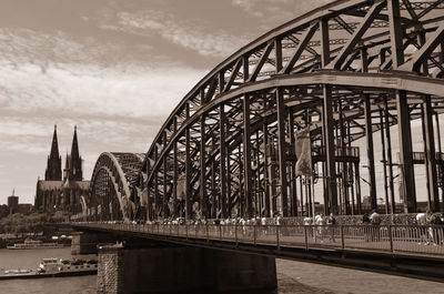 Hohenzollern bridge and cologne cathedral against sky in city