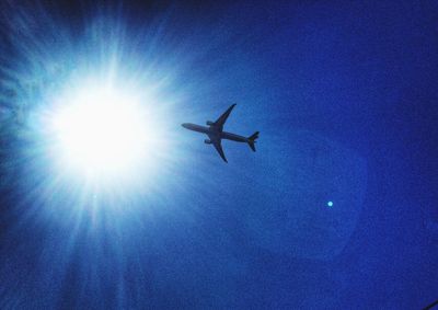 Low angle view of airplane flying in sky