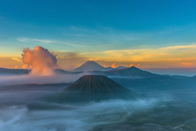 View of volcanic mountain against cloudy sky