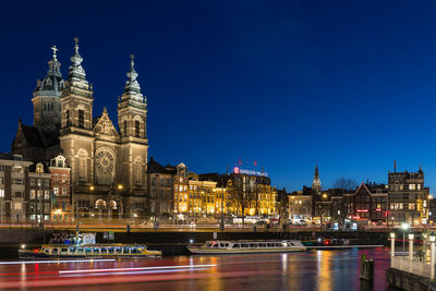 Illuminated buildings in city at night