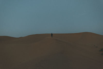 Scenic view of desert against clear sky