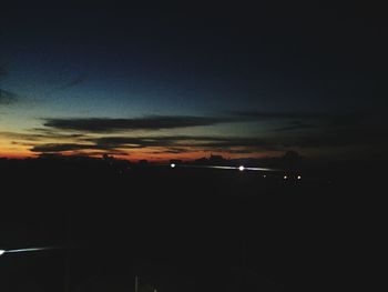 Silhouette landscape against sky at sunset