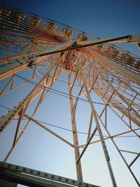 Low angle view of ferris wheel against clear sky