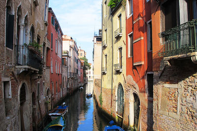 Panoramic view of canal amidst buildings in city