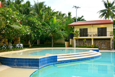 View of swimming pool by house